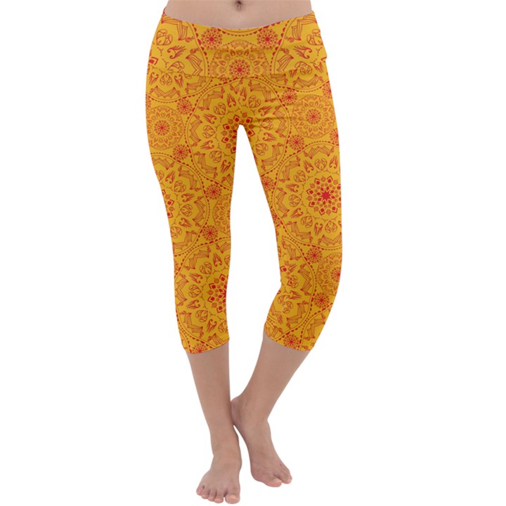 Solar mandala. Orange rangoli. Capri Yoga Leggings