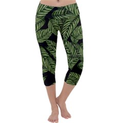 Tropical Leaves On Black Capri Yoga Leggings by snowwhitegirl