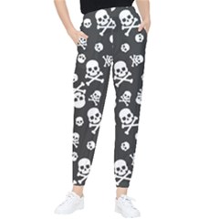 Skull And Cross Bone On Black Background Tapered Pants by AnkouArts