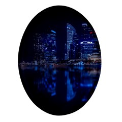 Illuminated Cityscape Against Blue Sky At Night Oval Glass Fridge Magnet (4 Pack) by Modalart